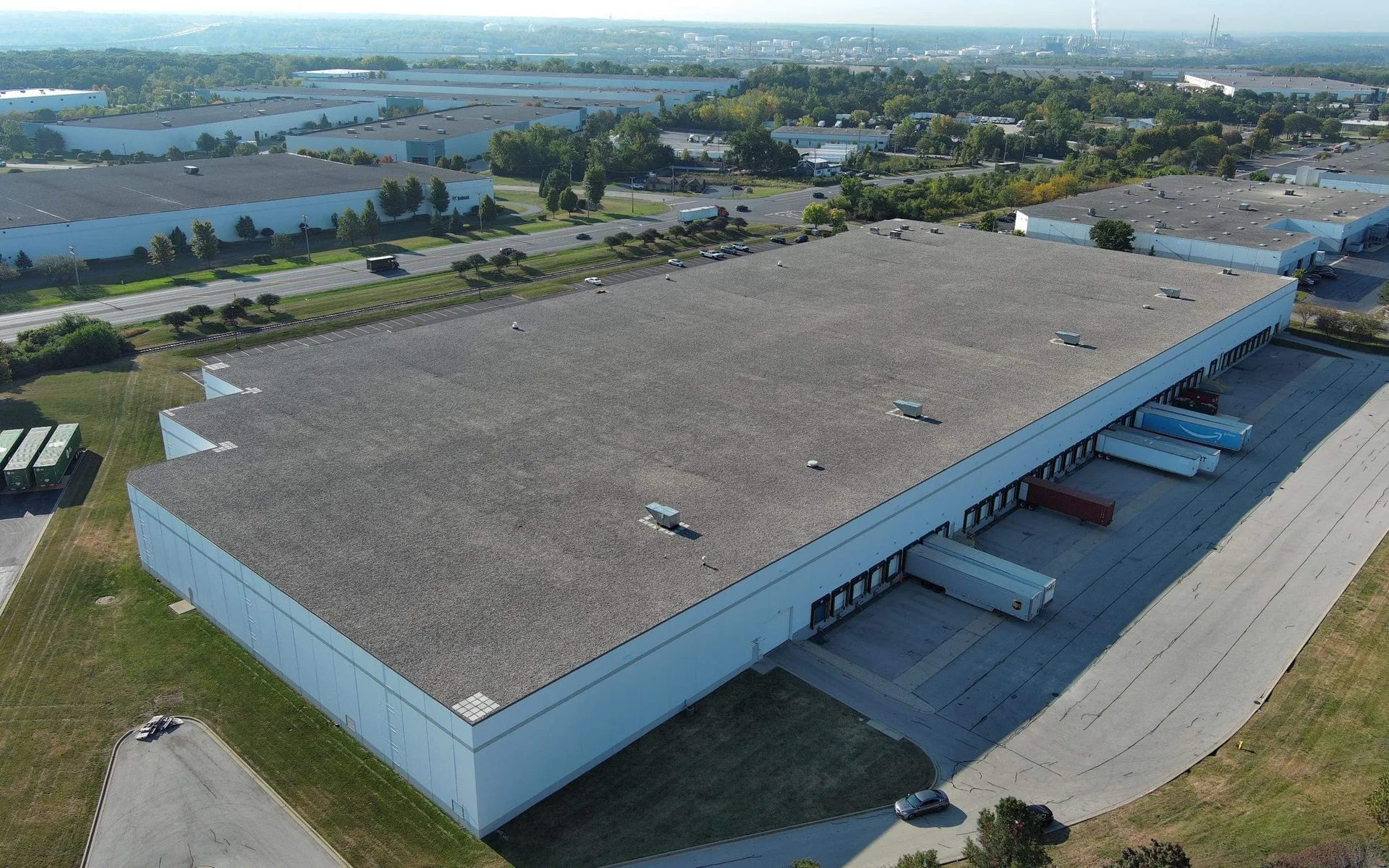 Aerial view of EPDM ballasted industrial flat roof during repair and preventative maintenance project by Americanstruction