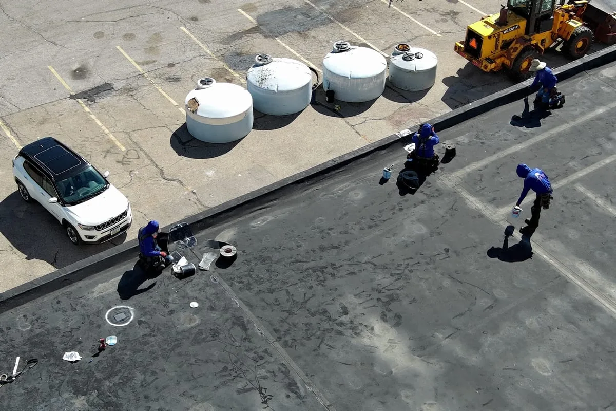 Americanstruction crew servicing a commercial EPDM roof