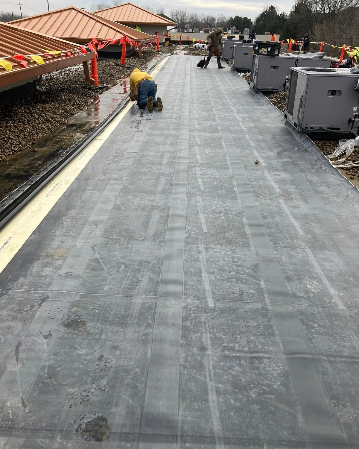 EPDM rubber recover in progress at 1149 E 9th St retail property