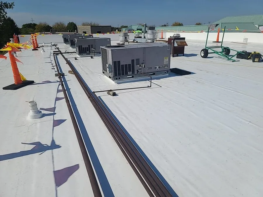 Completed PVC roof installation with HVAC curbs by Americanstruction