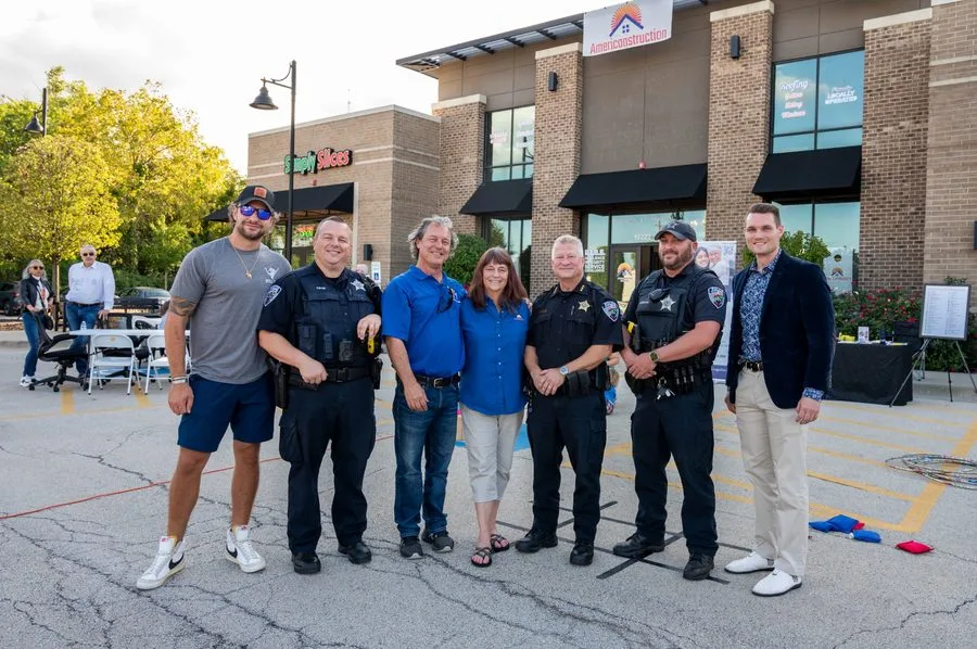 The Americanstruction team with Mokena first responders at the office
