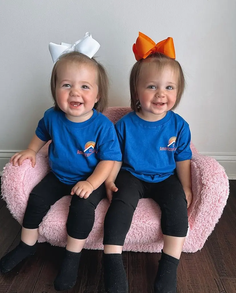 Two children wearing Americanstruction t-shirts