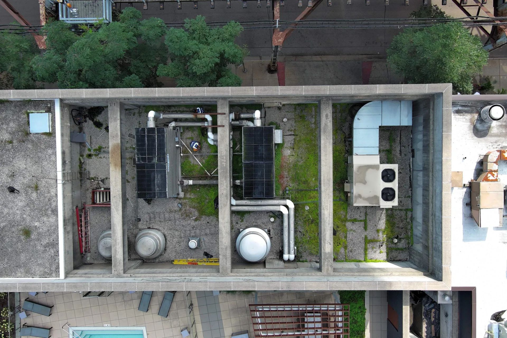 Aerial drone view of ballasted EPDM roof on Chicago multi-family apartment building before maintenance program