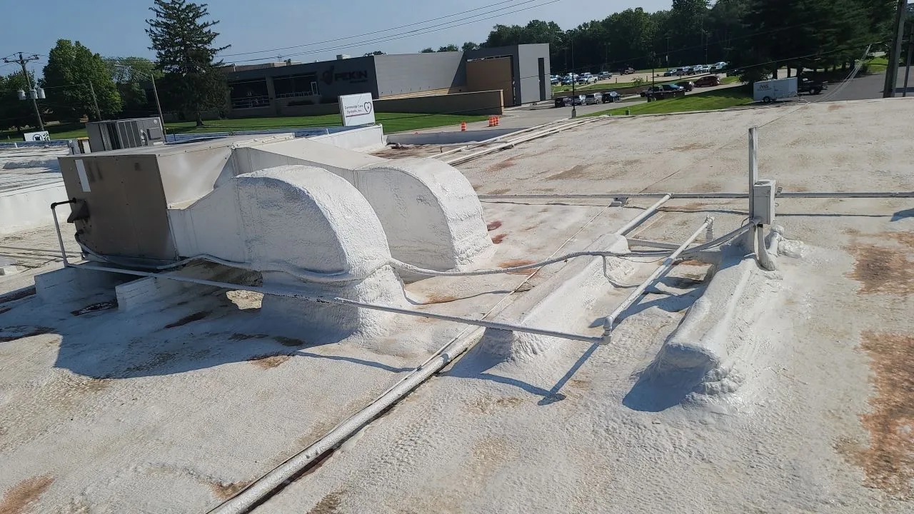 Aged office roof at Coldwell Banker Pekin IL before TPO tear-off