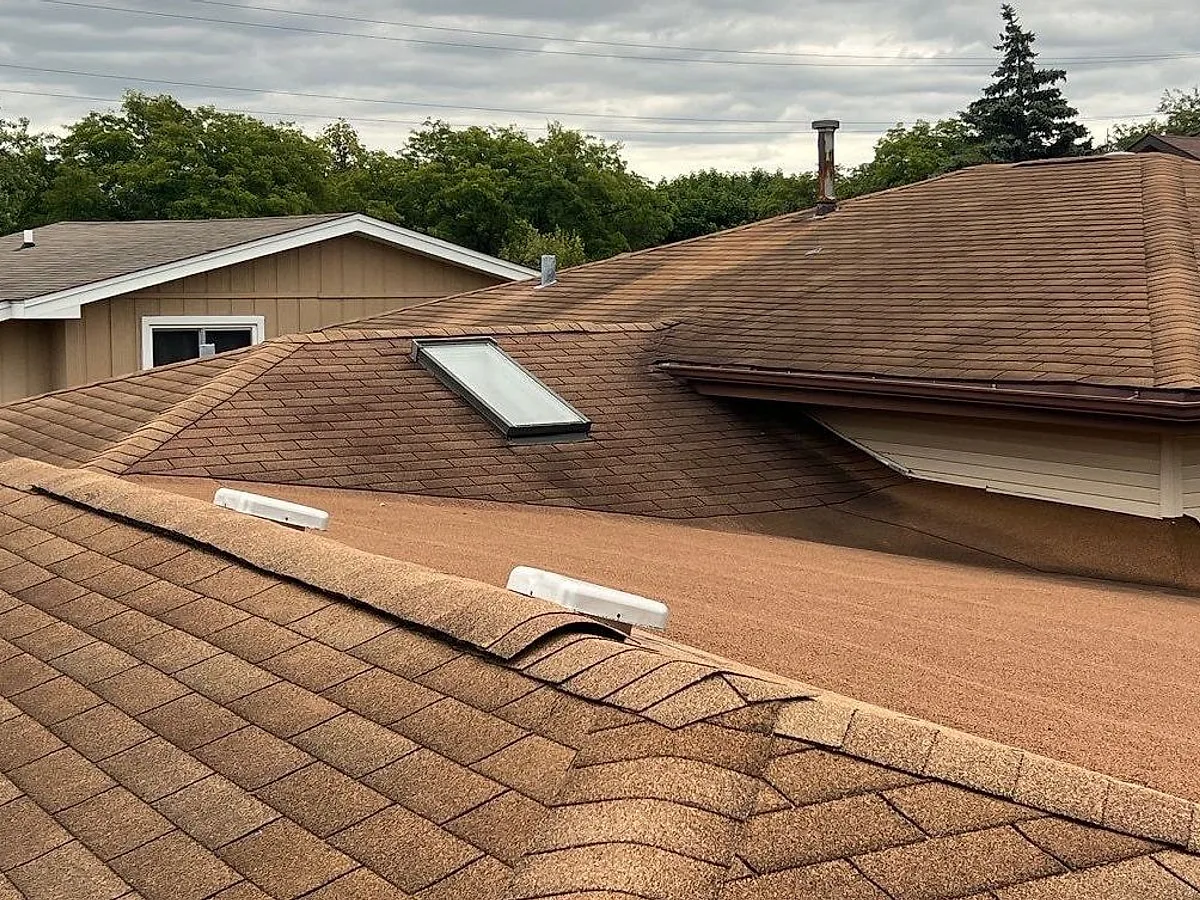 Aged asphalt shingle roof on the Thompson's Tinley Park home before replacement