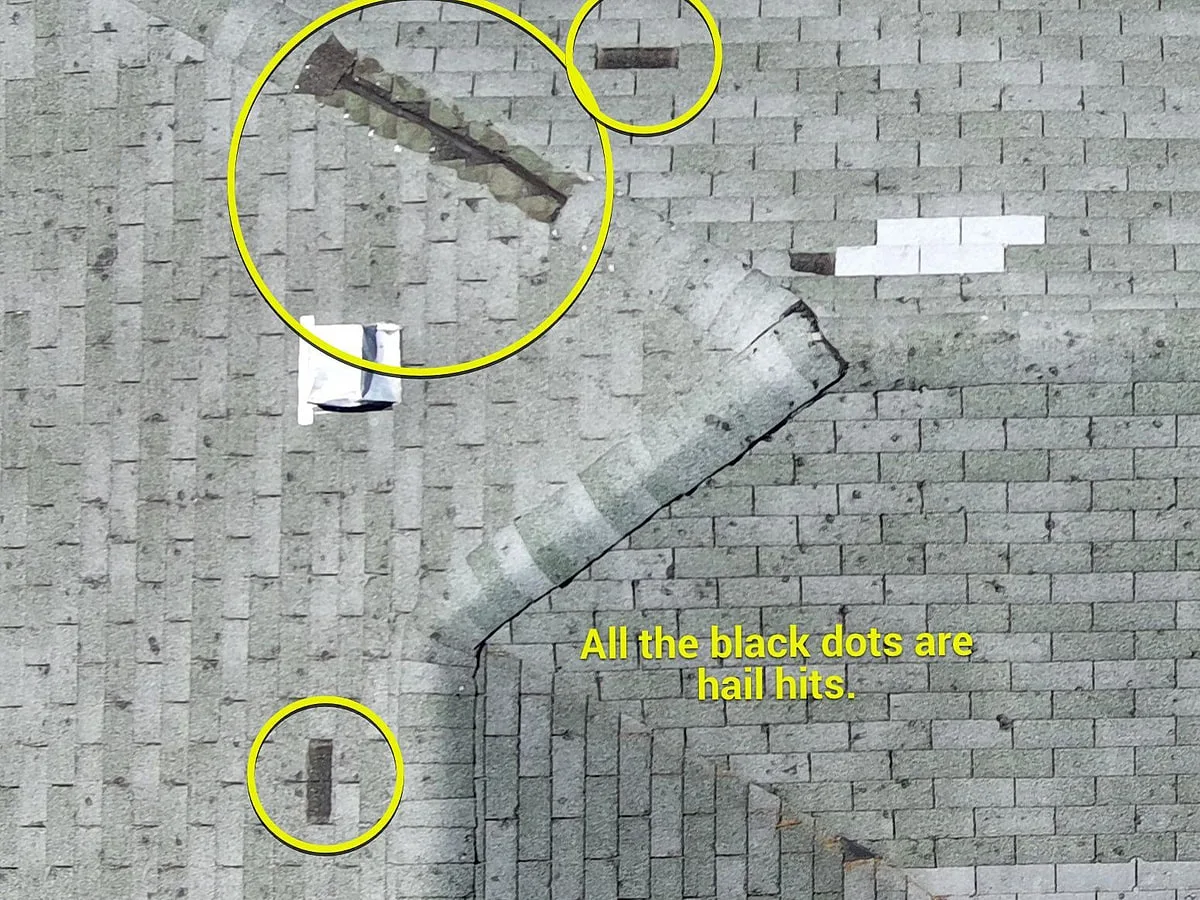 Drone aerial documentation of a hail-damaged residential roof with hits circled and annotated