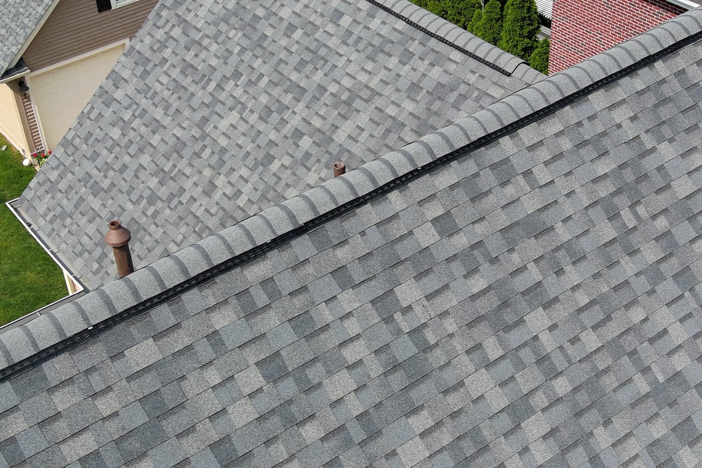 Close-up of architectural asphalt shingles showing dimensional profile